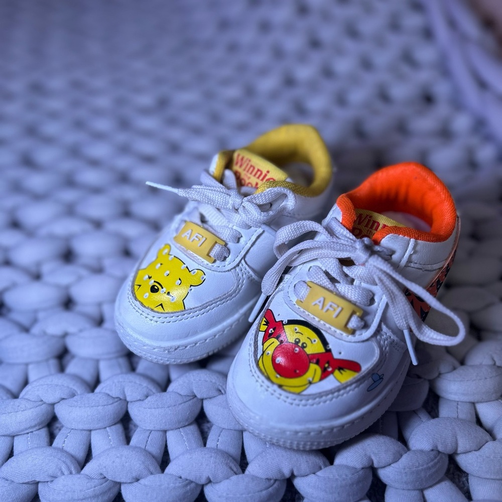 Nike Kids White Sneakers with Yellow and Orange Accents